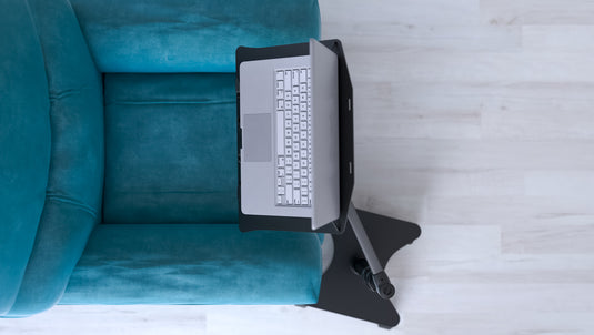 Another way to position your LEVO Laptop Workstation Stand is directly in front of your chair. The base makes a nice foot rest.